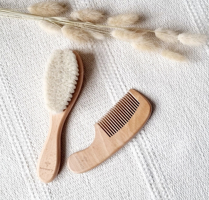 This beech wood comb and brush set features gentle bristles, specifically designed for baby hair.